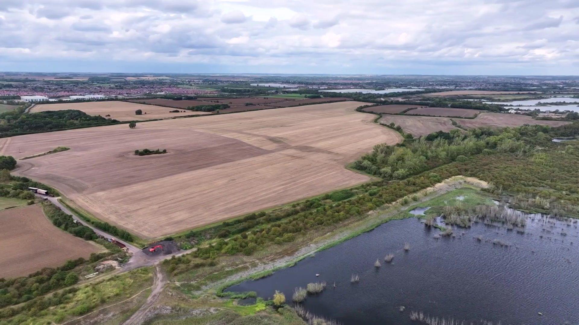 Aerial view of the future Universal site in Bedford. It is at this stage several fields and large lakes.